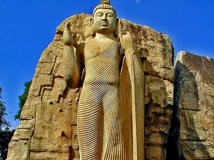 Aukana, Sri Lanka — A 12-metre standing Buddha carved from a single rock. Private driver and tours.