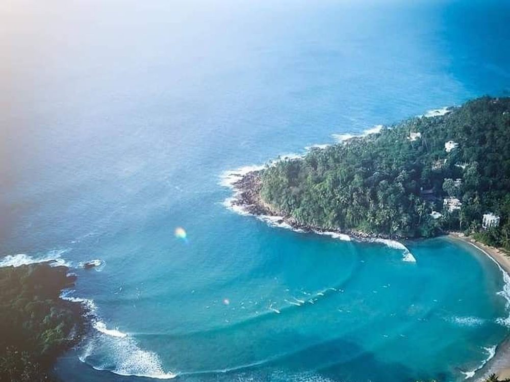 Hiriketiya, Sri Lanka — A tucked-away horseshoe cove loved by surfers. Private driver and tours.