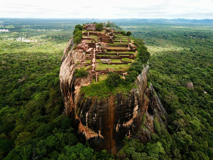 Sigiriya, Sri Lanka — Ancient rock fortress climbed by 1,200 steps above the jungle.
