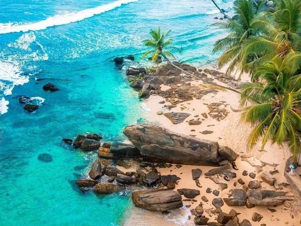 Unawatuna, Sri Lanka — A sheltered curve of sand ideal for easy swimming. Private driver and tours.